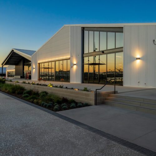 Architectural metal building in San Pedro, CA featuring glass walls.