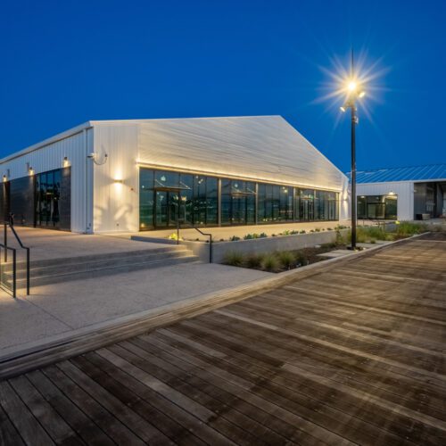 Night view of a commercial steel building.