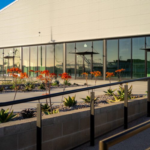 Retail center by Ecosteel featuring a glass facade.