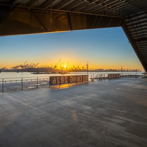 Sunset view from a luxury steel retail space interior.