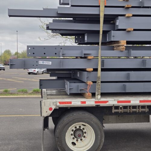Flat packed pre-engineered metal building delivery.