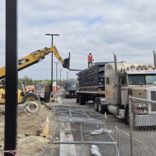 Offloading EcoSteel metal building components for Match Haus pickleball complex in Saint Charles, Illinois.